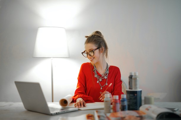 woman-in-red-long-sleeve-shirt-looking-at-her-laptop-3765132.jpg