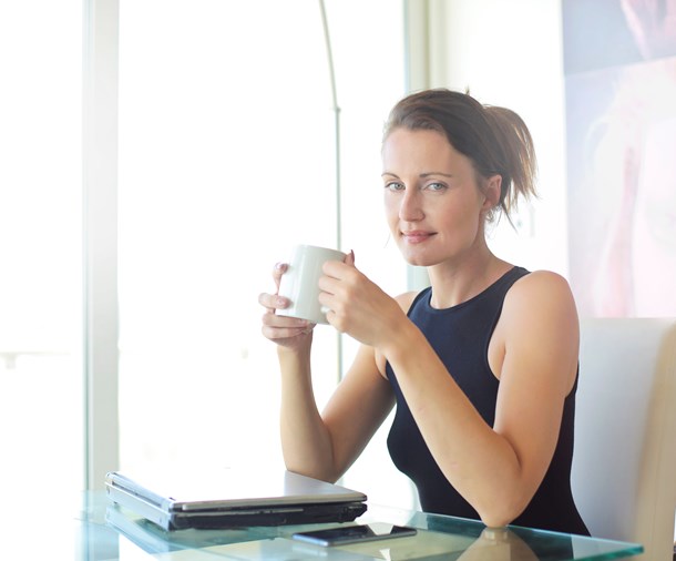 woman-in-black-tank-top-holding-white-ceramic-cup-3779760.jpg