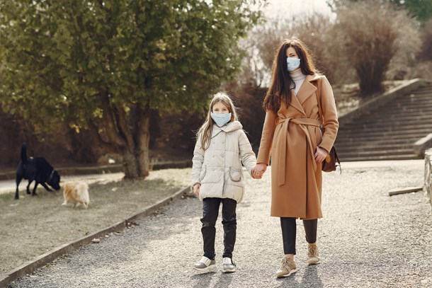 mother-with-daughter-in-face-masks-walking-in-park-4000622.jpg