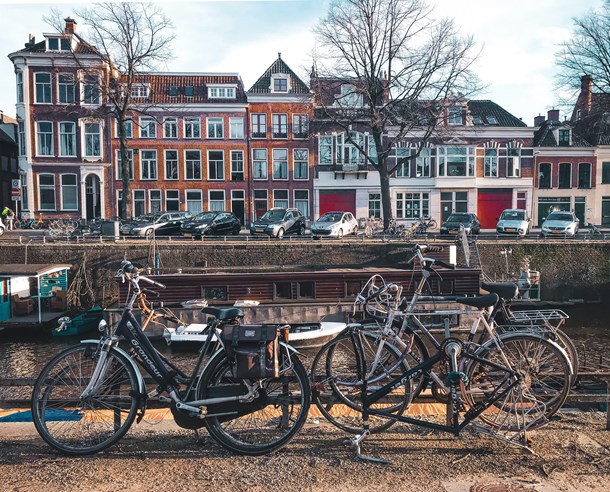 bicycles-parked-beside-brown-wooden-fence-near-a-river-3424845.jpg